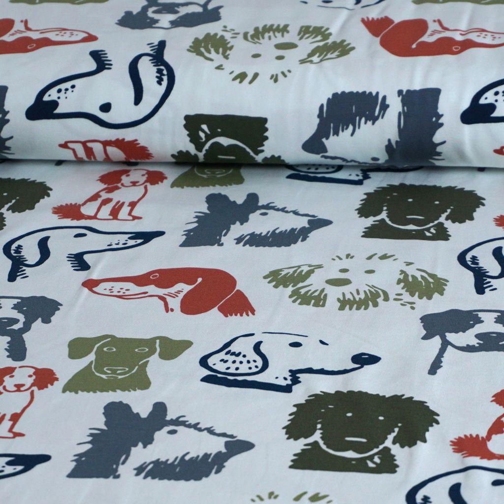 Baumwolljersey Hundeköpfe grün blau rostorange auf weiß